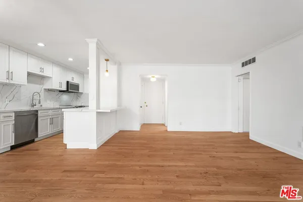 a view of kitchen with wooden floor
