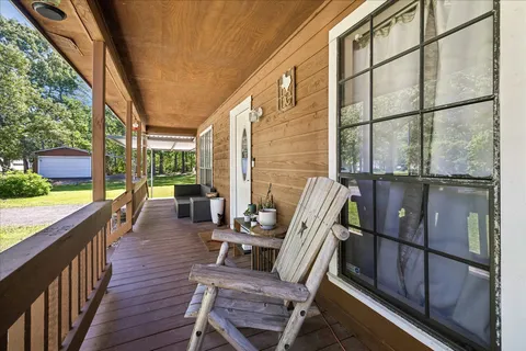 a view of a balcony with chairs