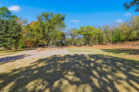 a view of outdoor space with lots of trees