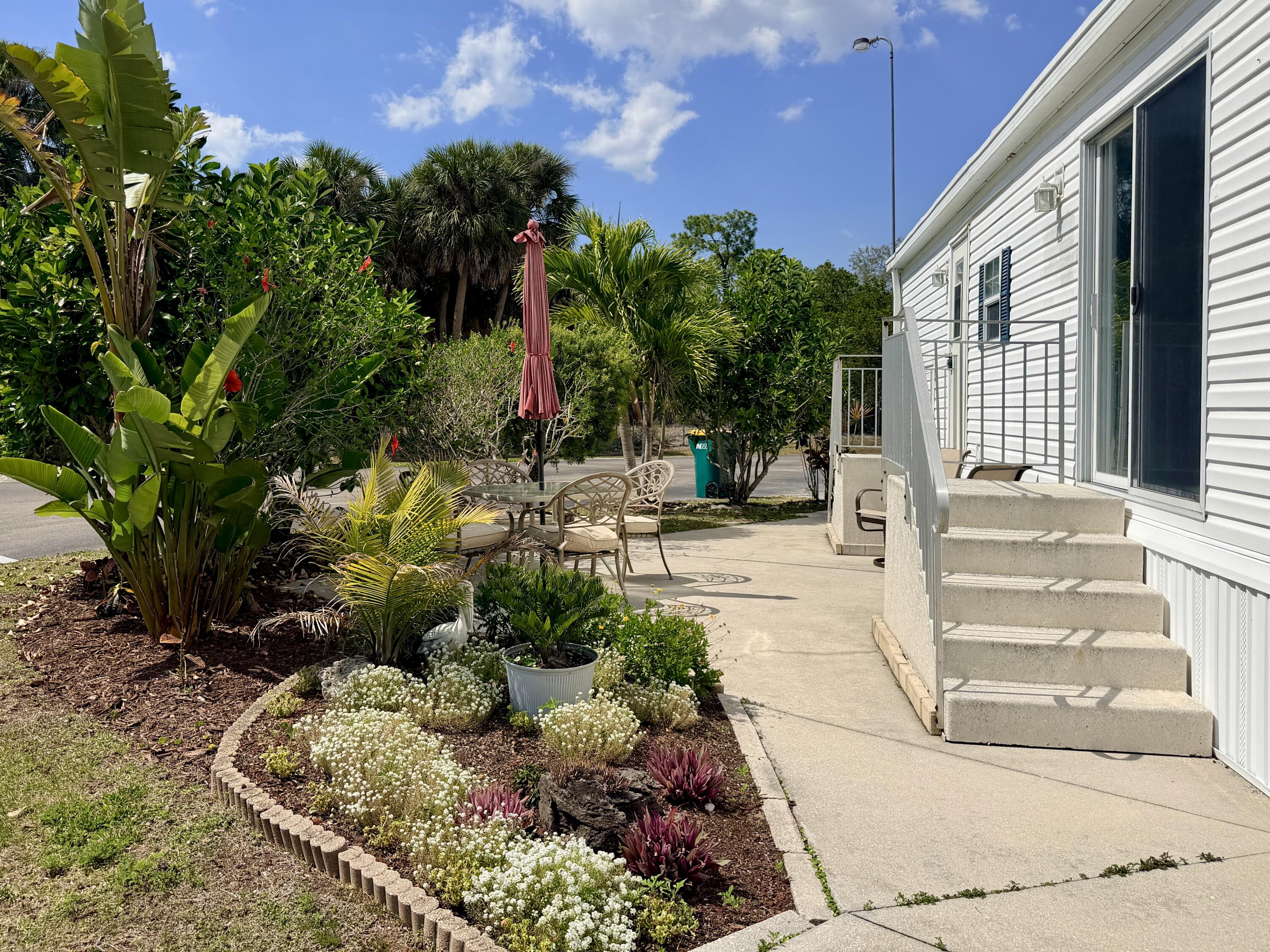 2 Jade Drive Naples, FL 34114 - Photo 1 of 44 a view of a pathway with a garden