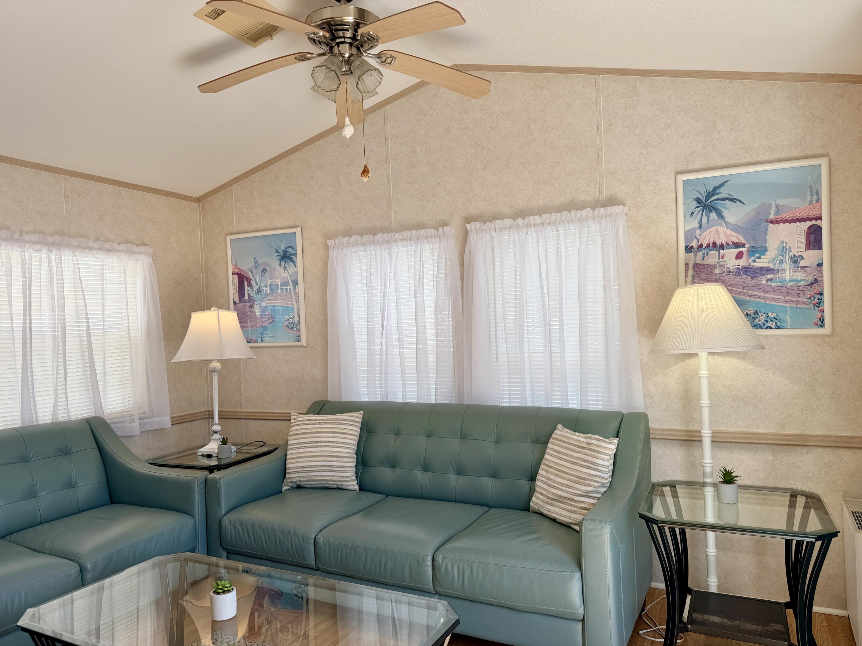 2 Jade Drive Naples, FL 34114 - Photo 19 of 44 a living room with furniture and a lamp