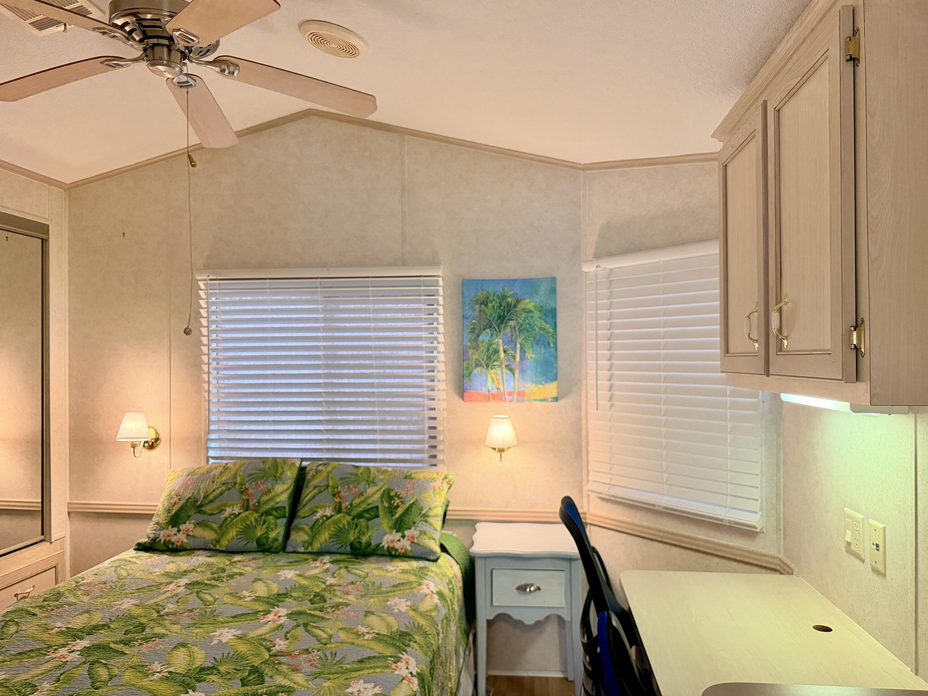 2 Jade Drive Naples, FL 34114 - Photo 20 of 44 a bedroom with a bed and a window