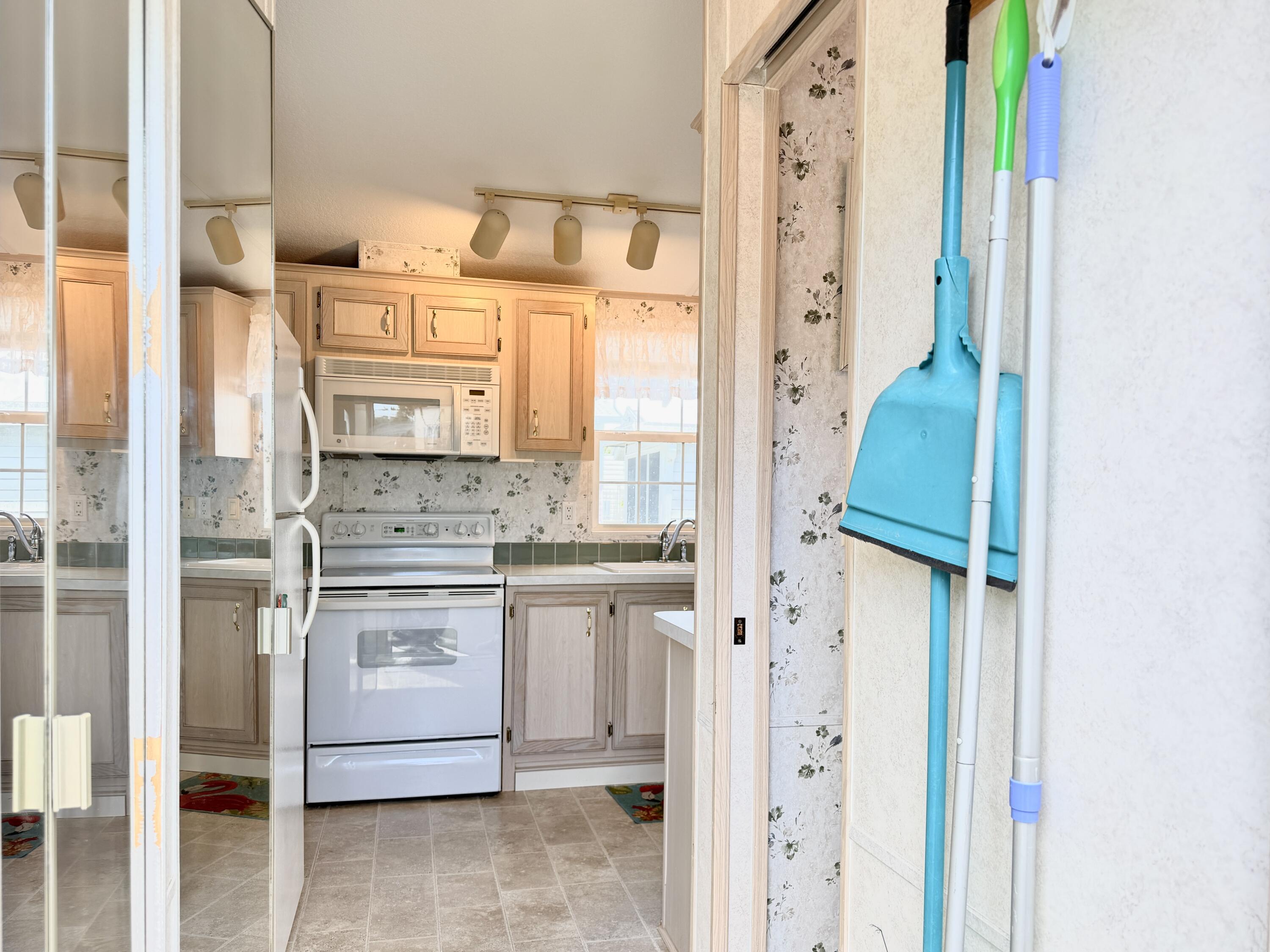 2 Jade Drive Naples, FL 34114 - Photo 2 of 44 a bathroom with a granite countertop sink a mirror and a shower