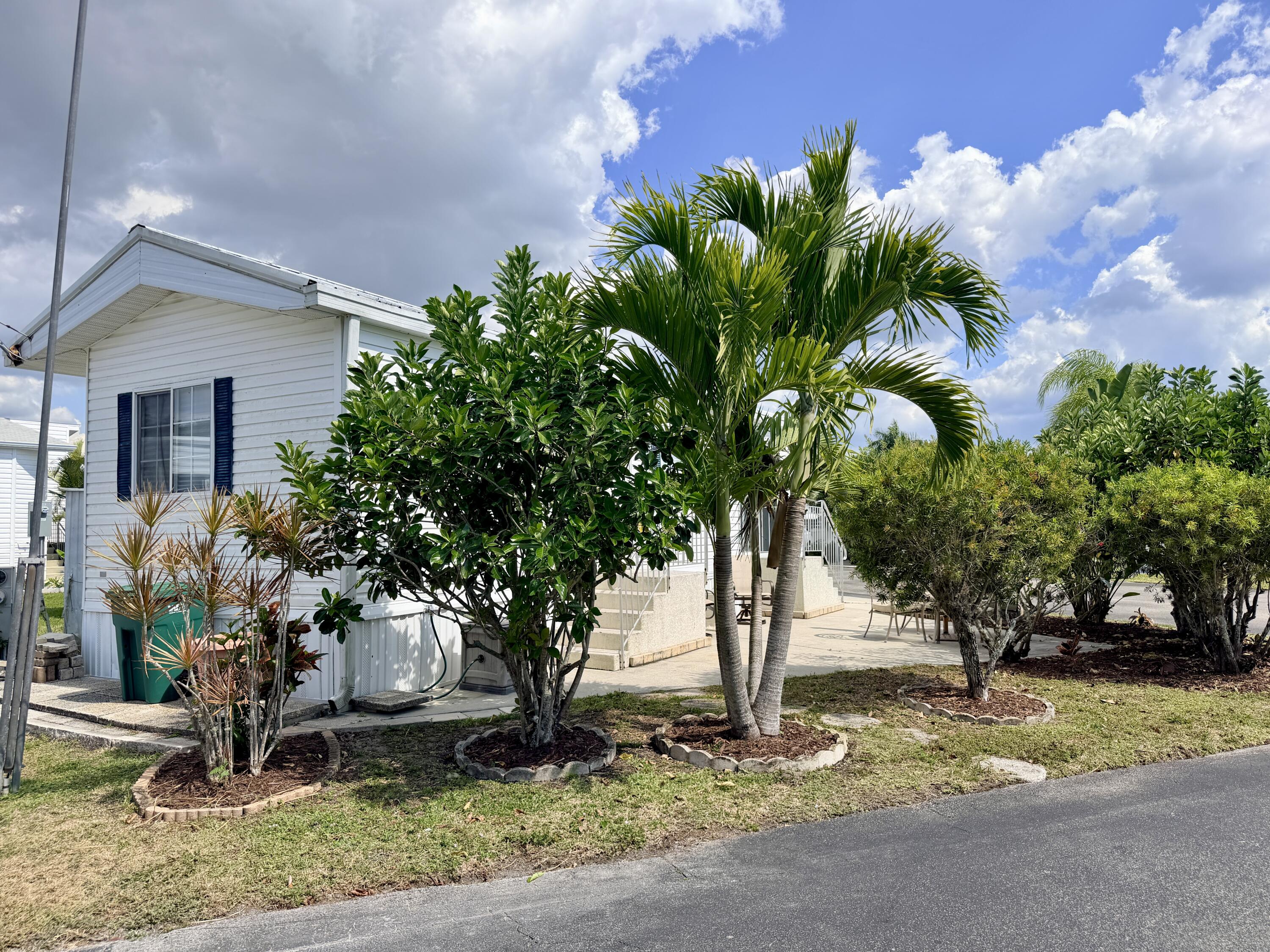 2 Jade Drive Naples, FL 34114 - Photo 27 of 44 a plant is in front of a house