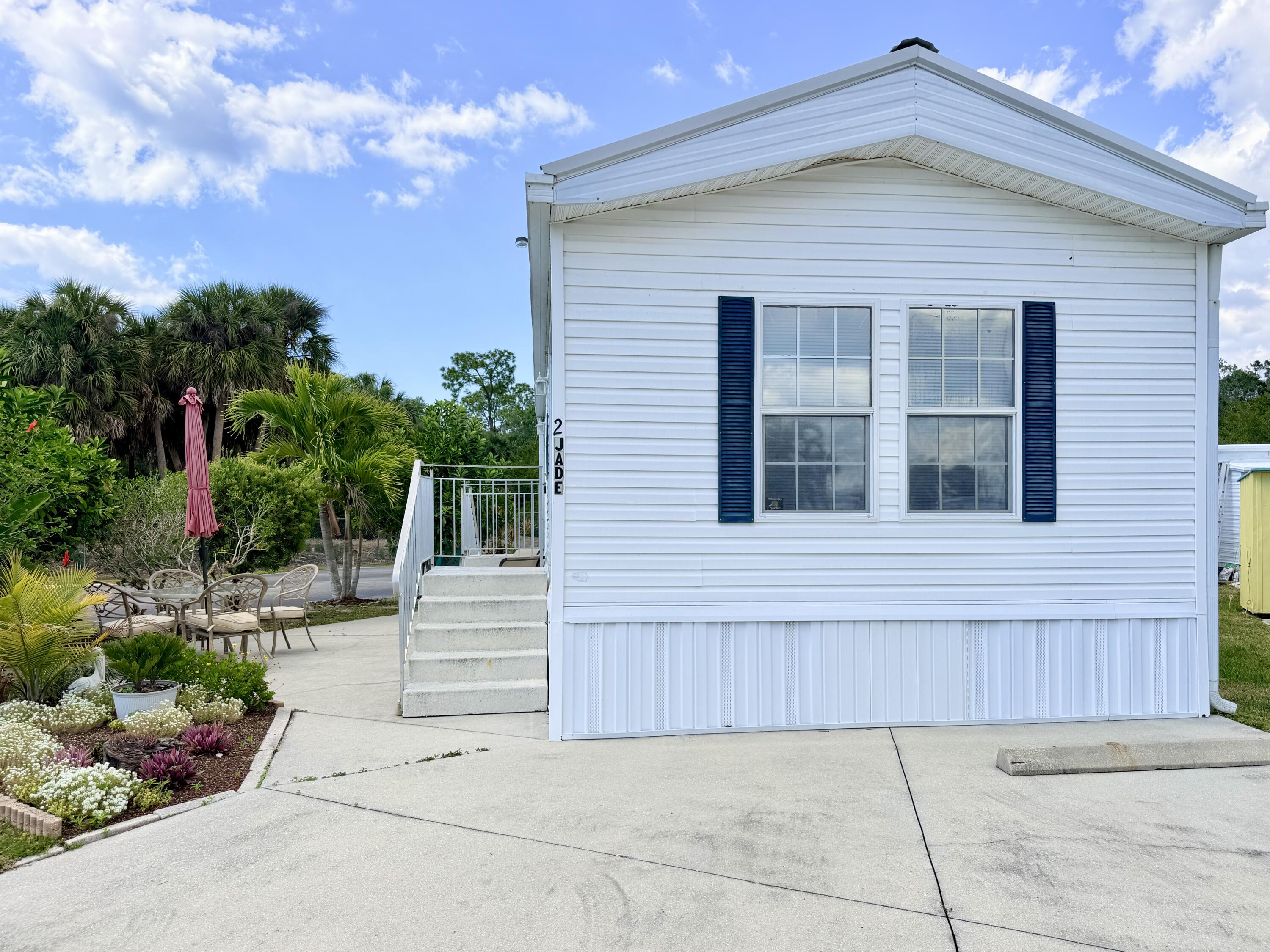 2 Jade Drive Naples, FL 34114 - Photo 29 of 44 a view of a house with a yard