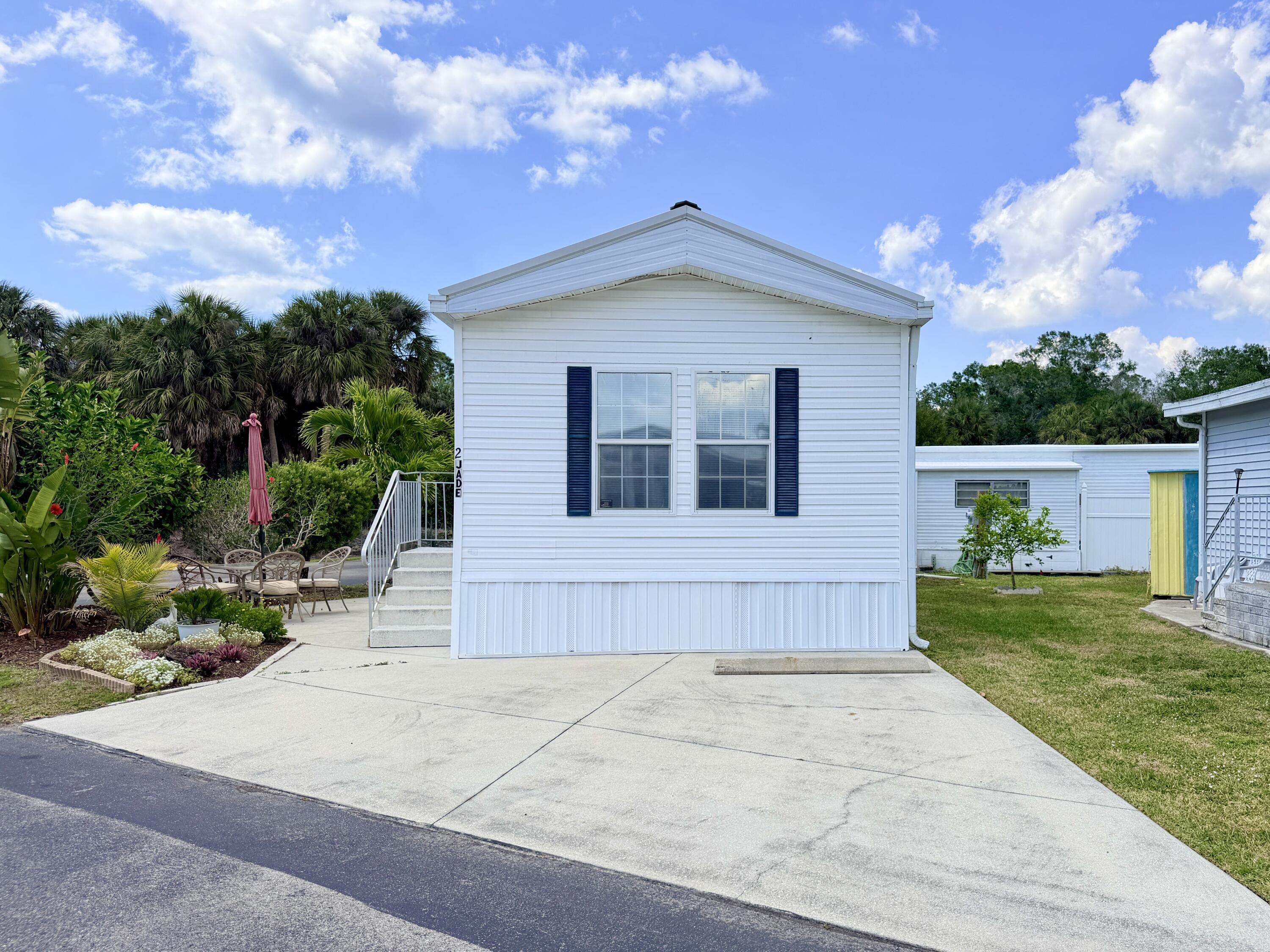 2 Jade Drive Naples, FL 34114 - Photo 30 of 44 a house view with a garden space