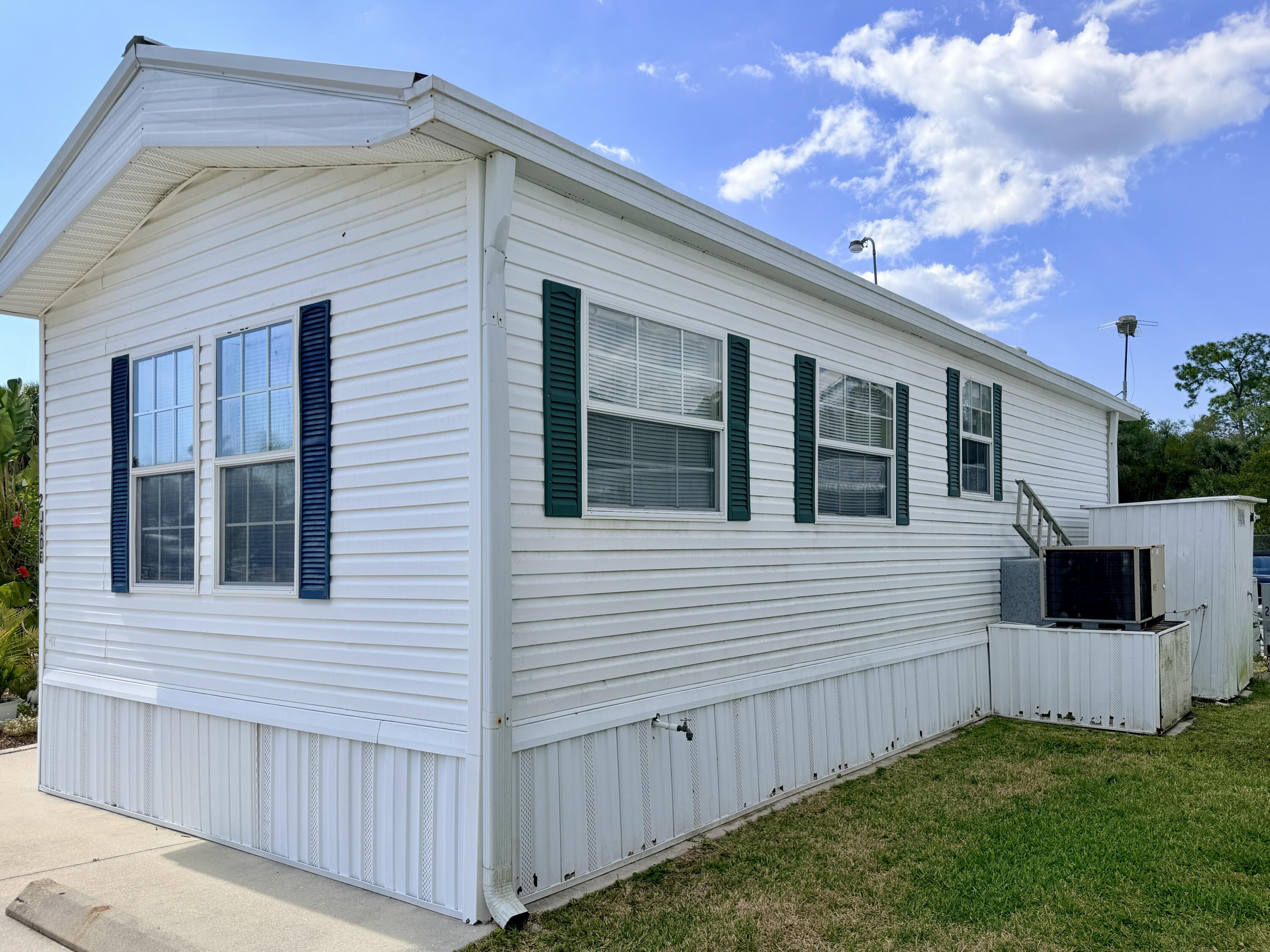 2 Jade Drive Naples, FL 34114 - Photo 33 of 44 a view of a house with a yard