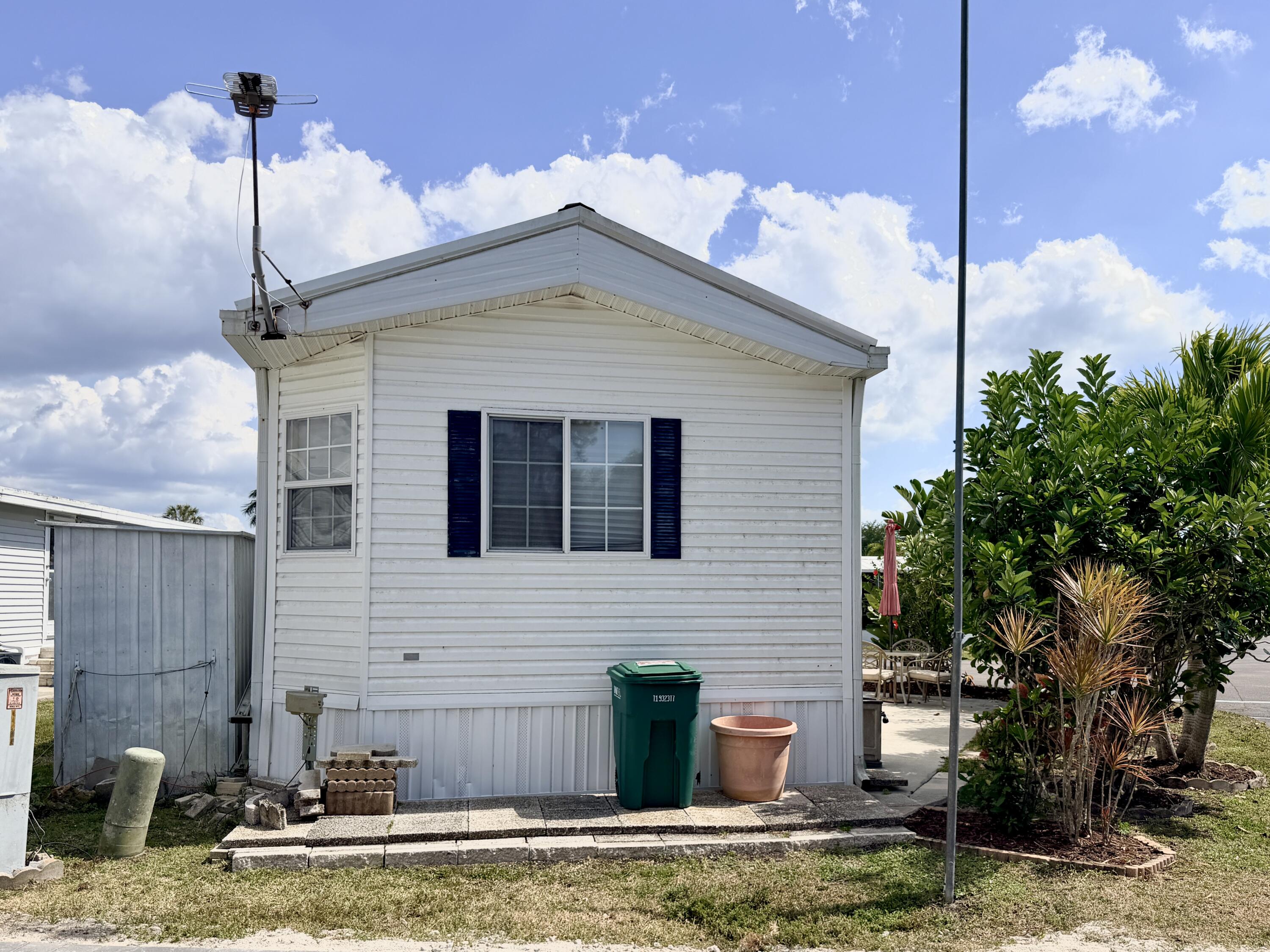 2 Jade Drive Naples, FL 34114 - Photo 34 of 44 a front view of a house with garden