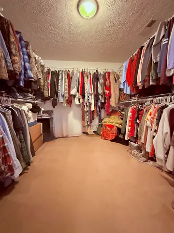 a very nice looking room with a large window and a chandelier