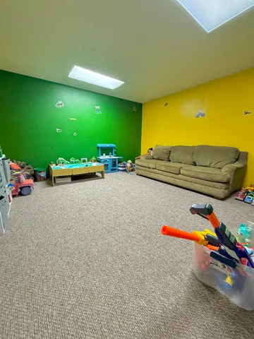 a view of a chairs and table on the wooden deck