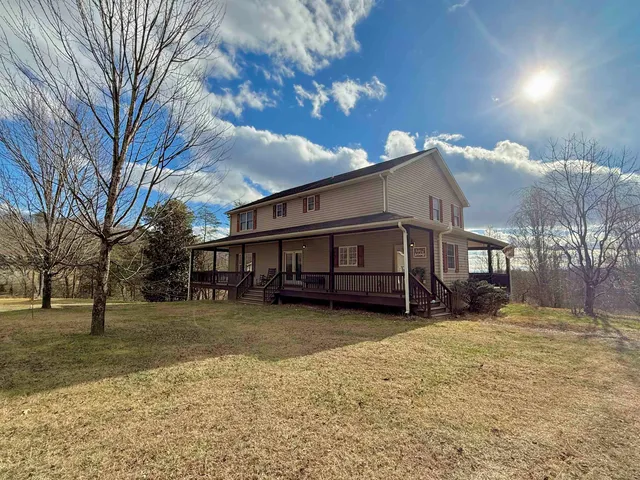 a view of a backyard of the house