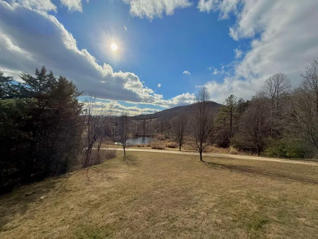 a view of a garage with a bike and car