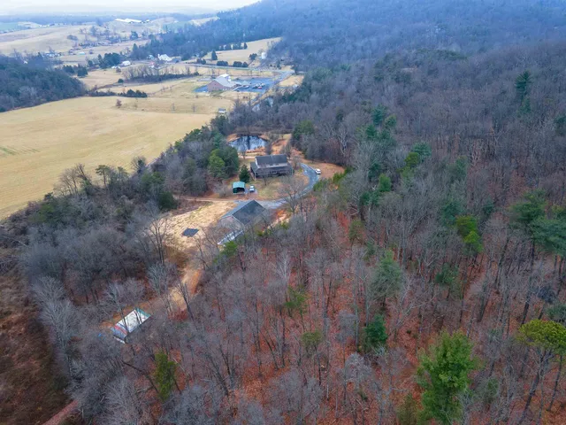 a view of house with a yard in front of it