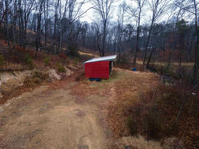 a black and white photo of a bench