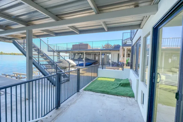 a view of a balcony with chairs