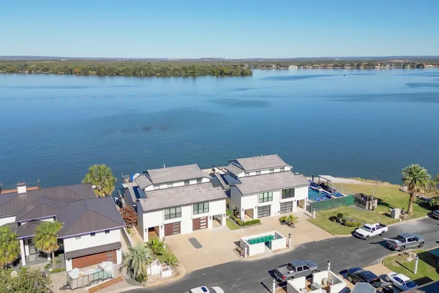 an aerial view of a house with lake view