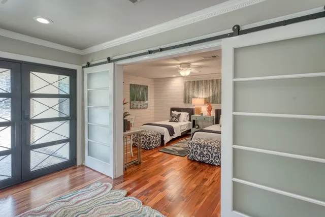 a bedroom with double bed and a window