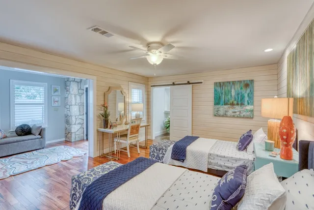 a bathroom with a sink a toilet and a shower