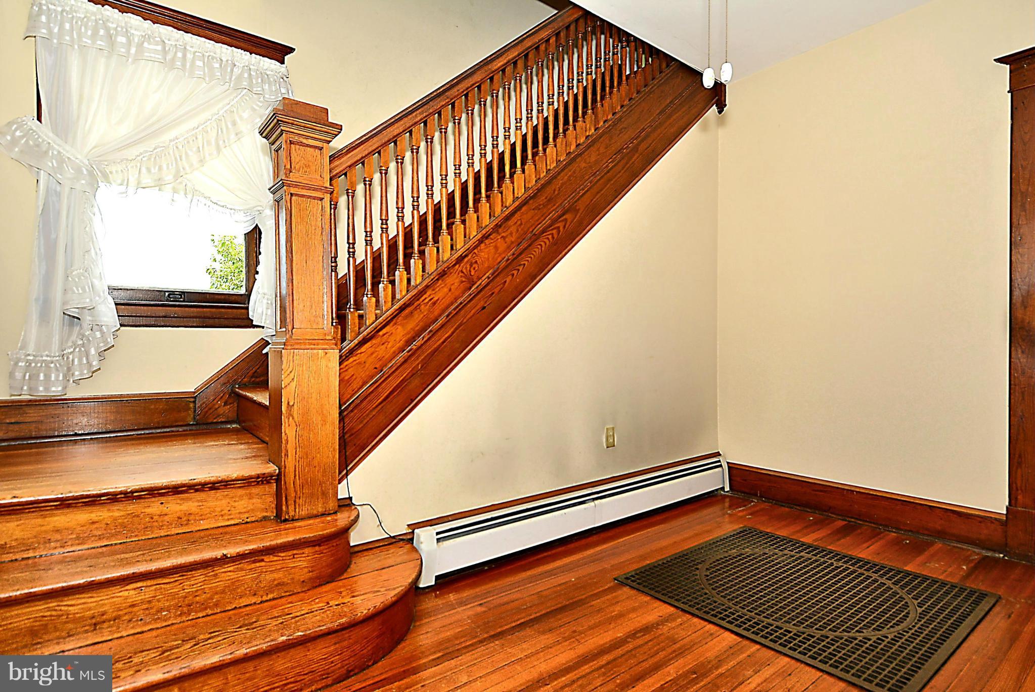 15425 Barnesville Road Boyds, MD 20841 - Photo 5 of 30 a view of a room with wooden floor and windows
