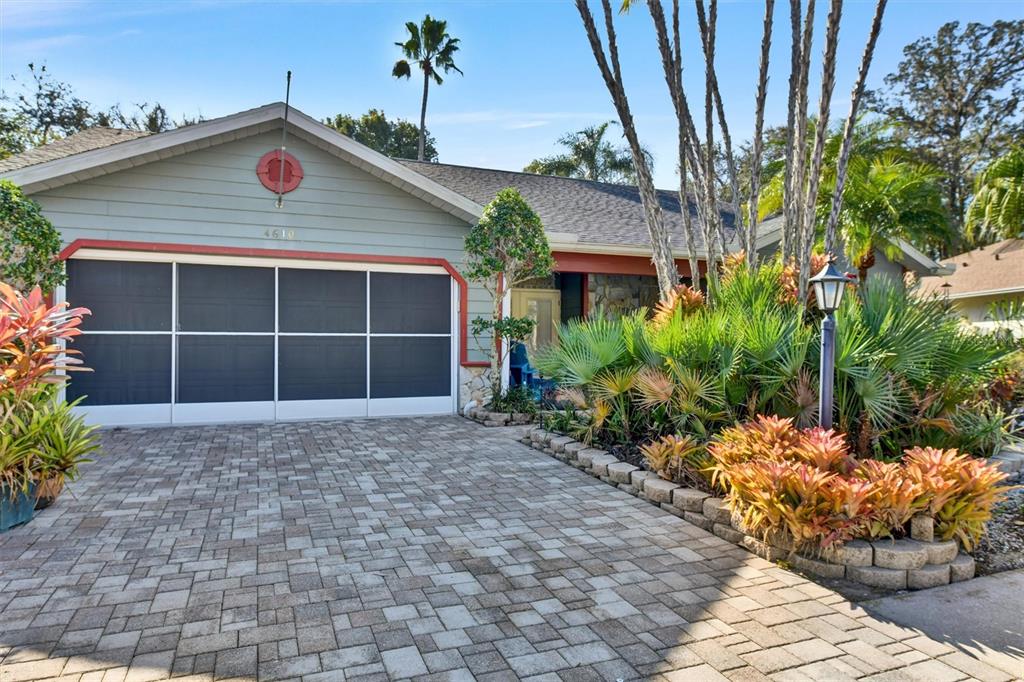 4610 Sandpointe Drive New Port Richey, FL 34655 - Photo 1 of 1 a front view of a house with a yard and a garage