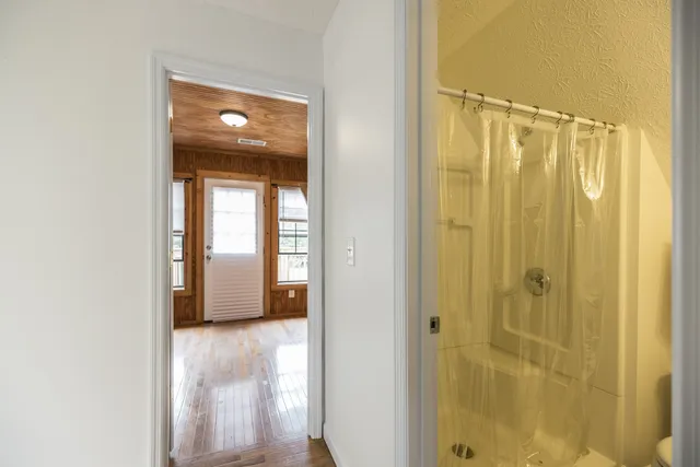 a bathroom with a bathtub and a shower