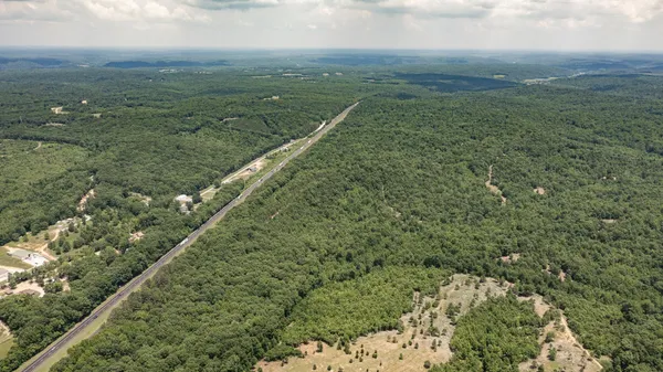 a view of a field with an ocean
