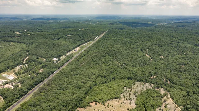a view of a field with an ocean