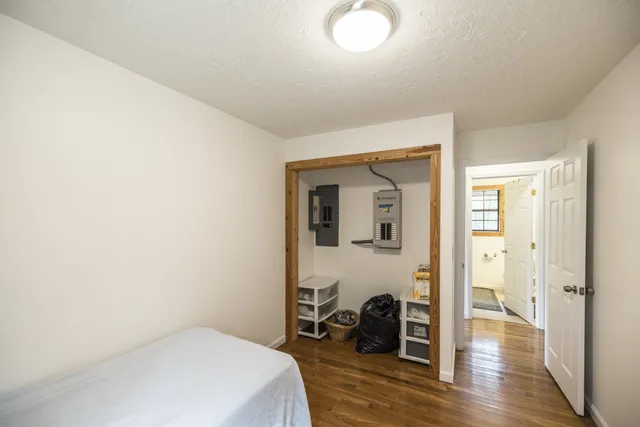 a view of a wooden house with a yard