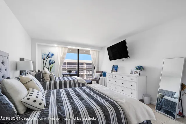 a view of a dining room with furniture and a window