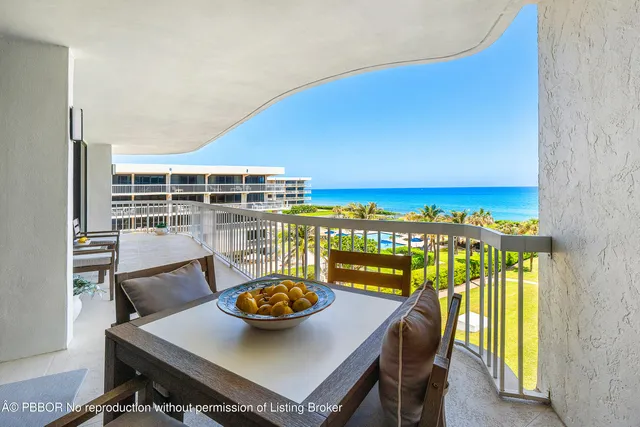 a view of a chairs and table in patio