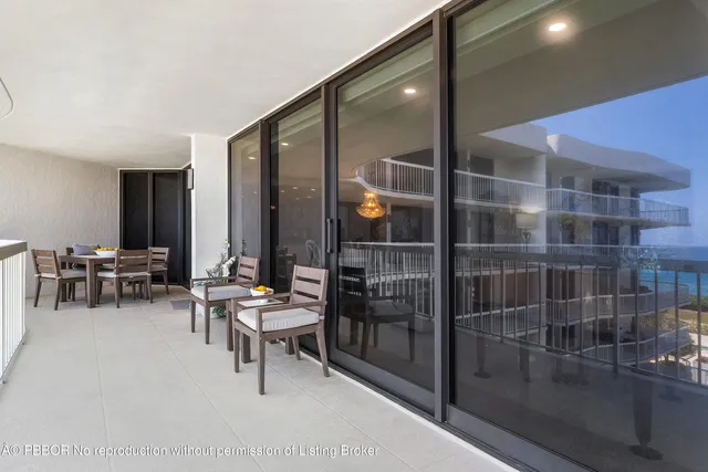 a view of a balcony with chairs