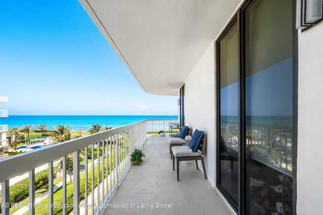 a bedroom with bed and a large window