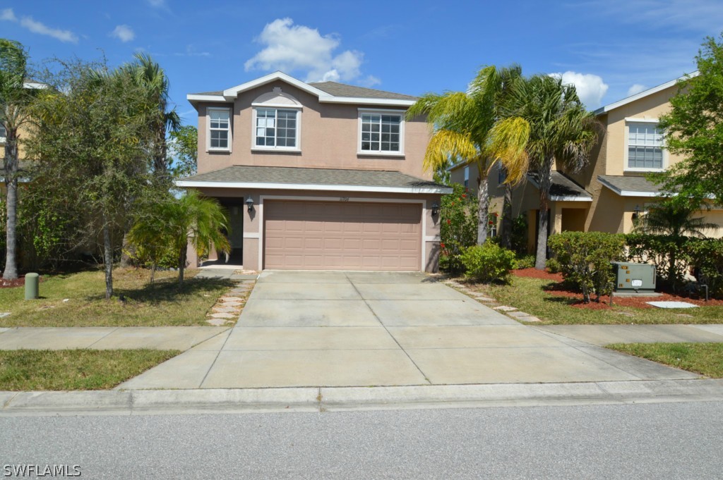 11706 Tempest Harbor Loop Venice, FL 34292 - Photo 1 of 20 a front view of a house with garden