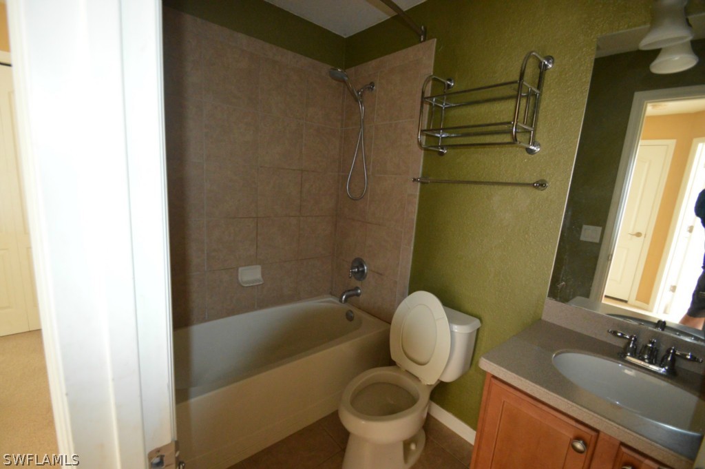 11706 Tempest Harbor Loop Venice, FL 34292 - Photo 13 of 20 a bathroom with a sink toilet and shower