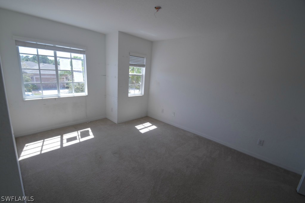 11706 Tempest Harbor Loop Venice, FL 34292 - Photo 14 of 20 a view of an empty room with a window
