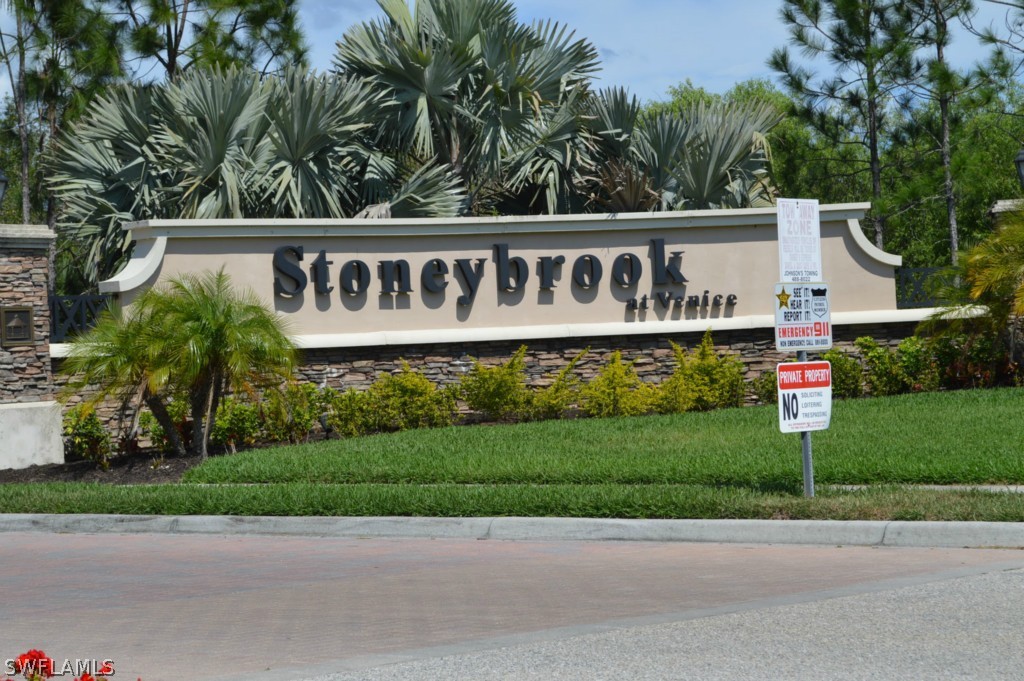 11706 Tempest Harbor Loop Venice, FL 34292 - Photo 19 of 20 a sign that is sitting on a brick wall