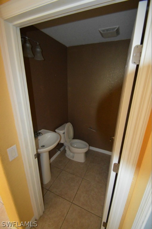 11706 Tempest Harbor Loop Venice, FL 34292 - Photo 7 of 20 a bathroom with a sink and a toilet