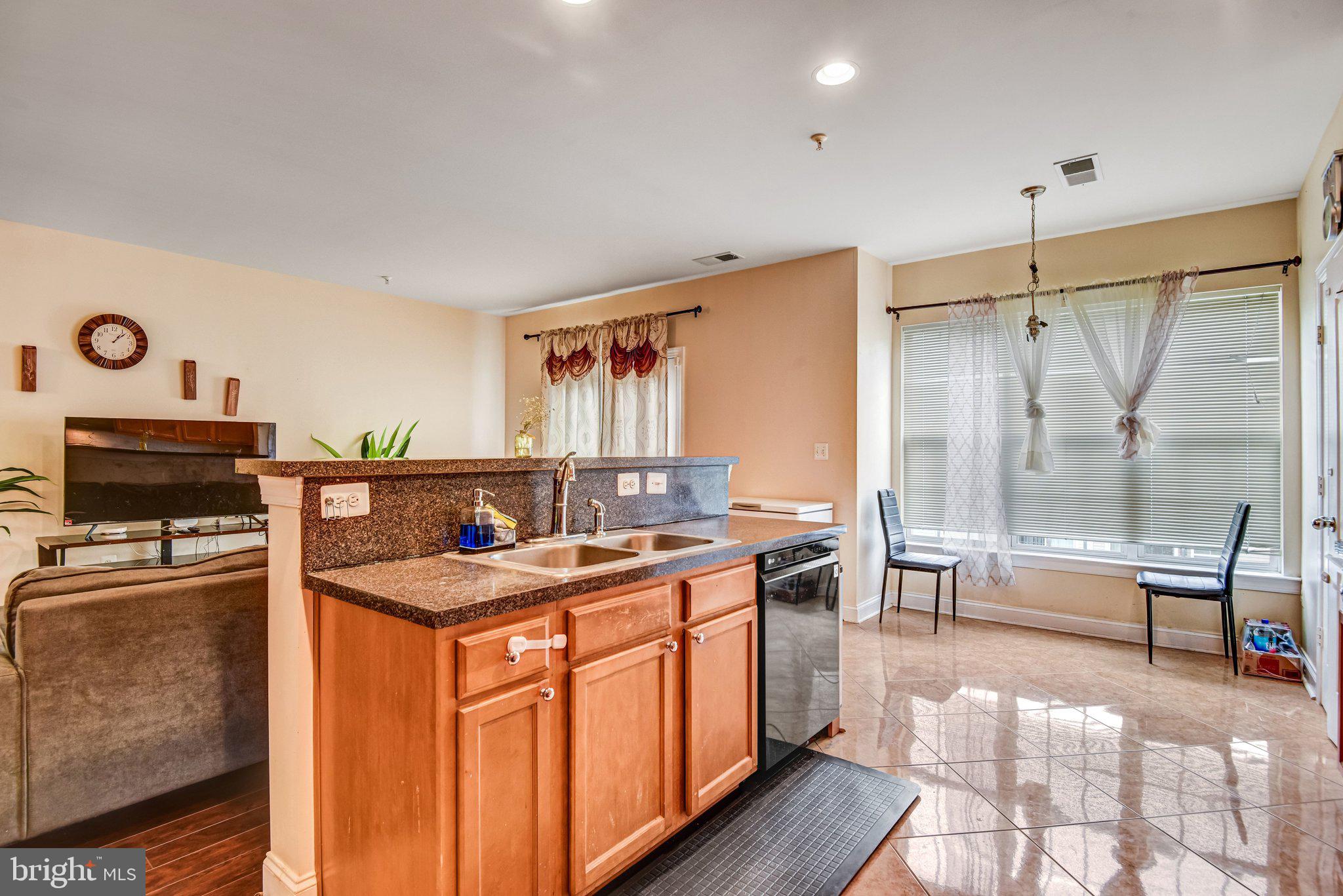 4112 Potomac Highlands Circle Triangle, VA 22172 - Photo 6 of 41 a kitchen with stainless steel appliances granite countertop a sink stove and refrigerator