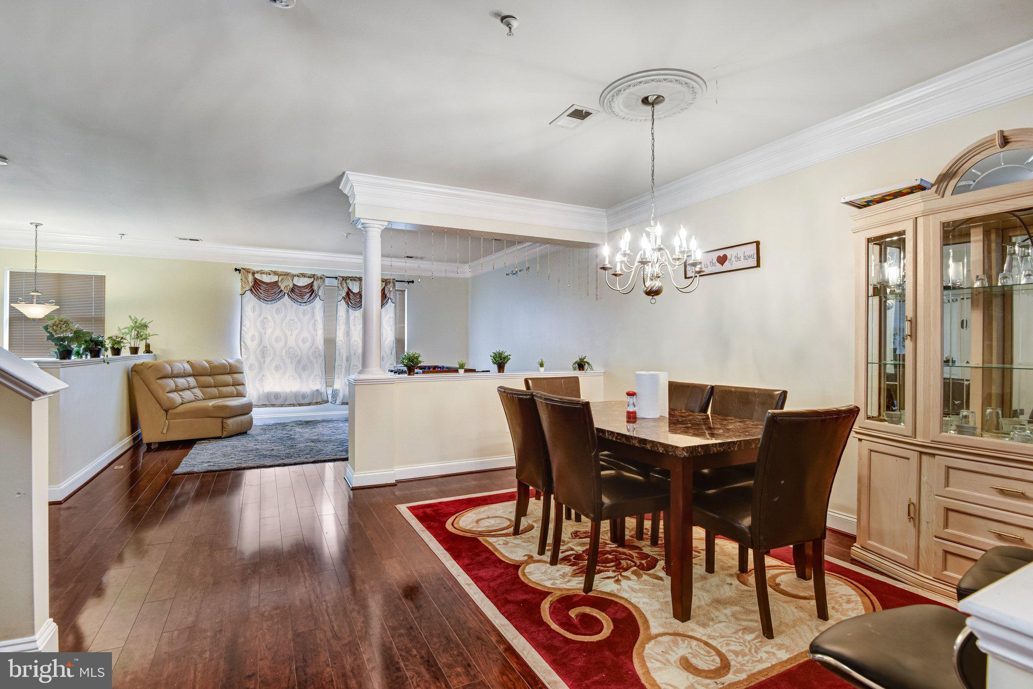 4112 Potomac Highlands Circle Triangle, VA 22172 - Photo 7 of 41 a view of a dining room with furniture and wooden floor