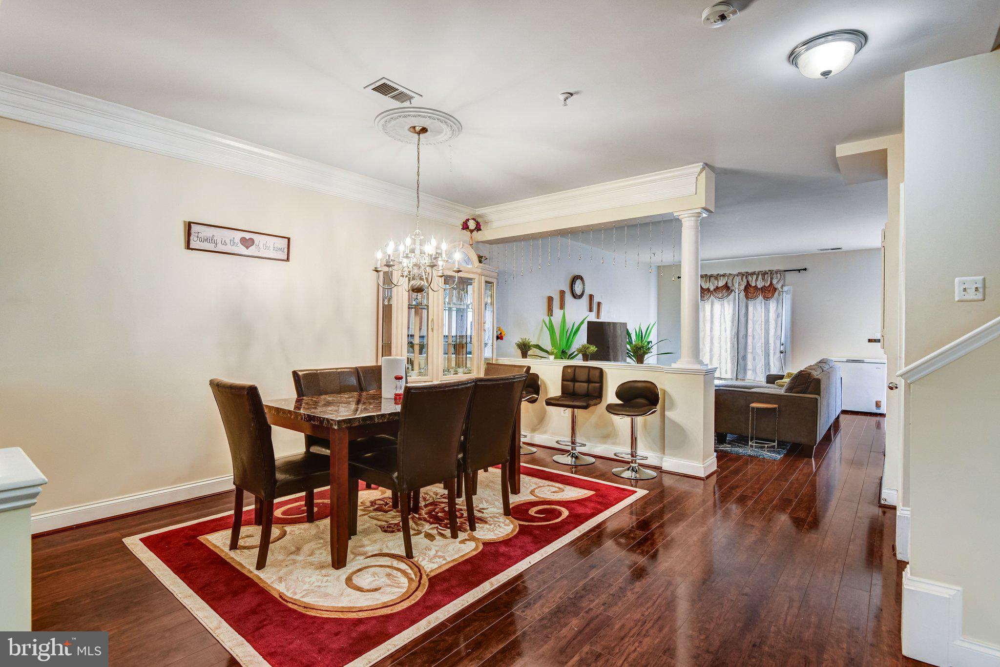4112 Potomac Highlands Circle Triangle, VA 22172 - Photo 9 of 41 a view of a dining room with furniture and wooden floor