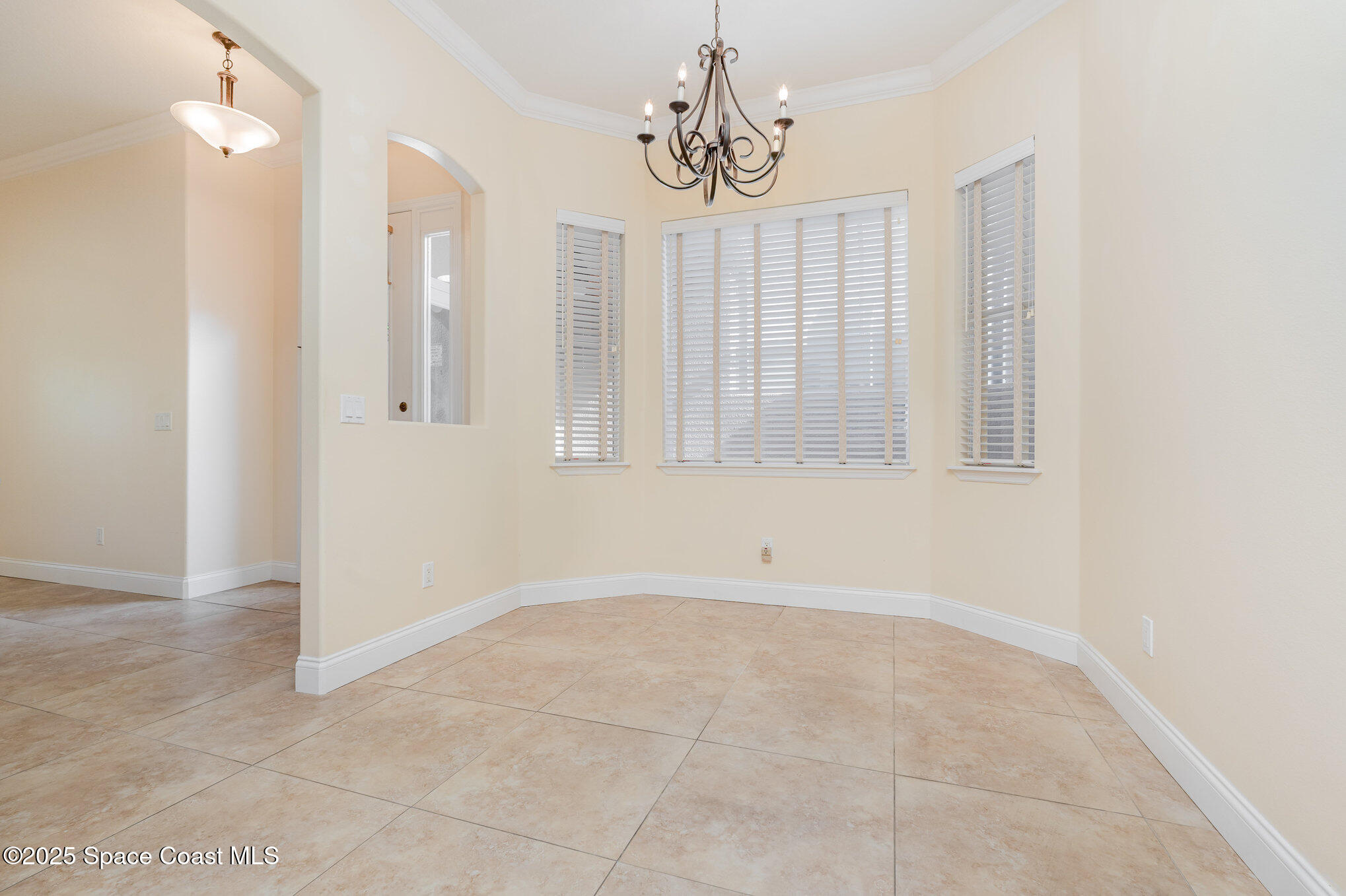 4150 Alamanda Key Drive Melbourne, FL 32901 - Photo 14 of 65 a view of a chandelier fan and entryway