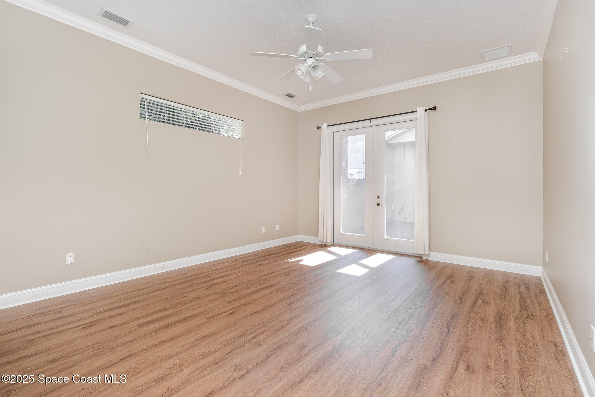 4150 Alamanda Key Drive Melbourne, FL 32901 - Photo 16 of 65 a view of an empty room with wooden floor