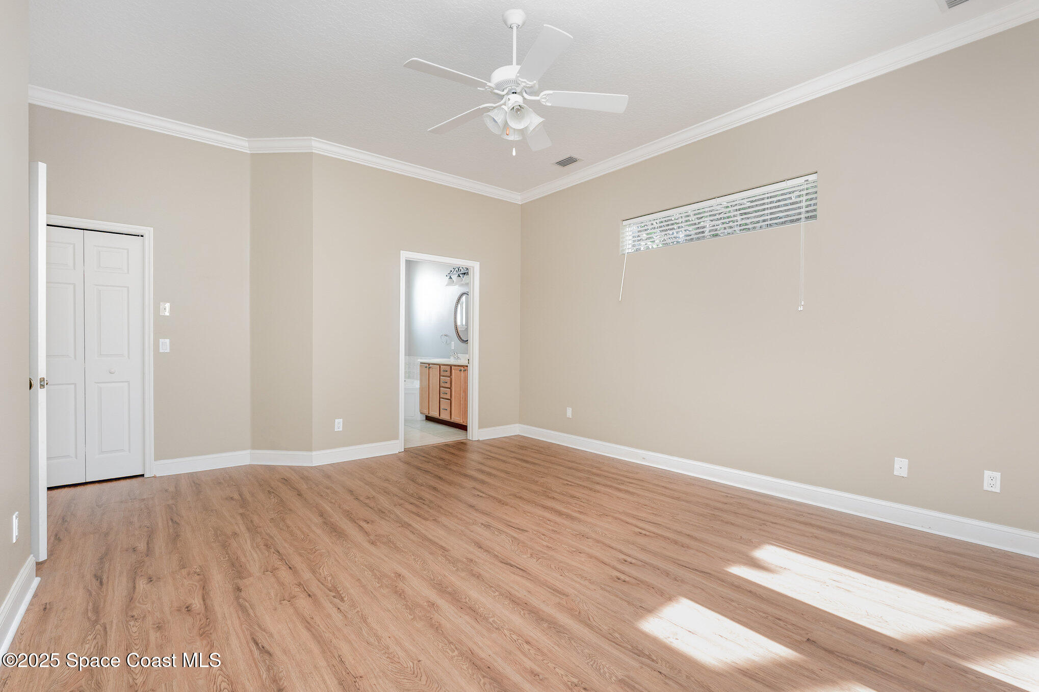 4150 Alamanda Key Drive Melbourne, FL 32901 - Photo 18 of 65 a view of an empty room with wooden floor