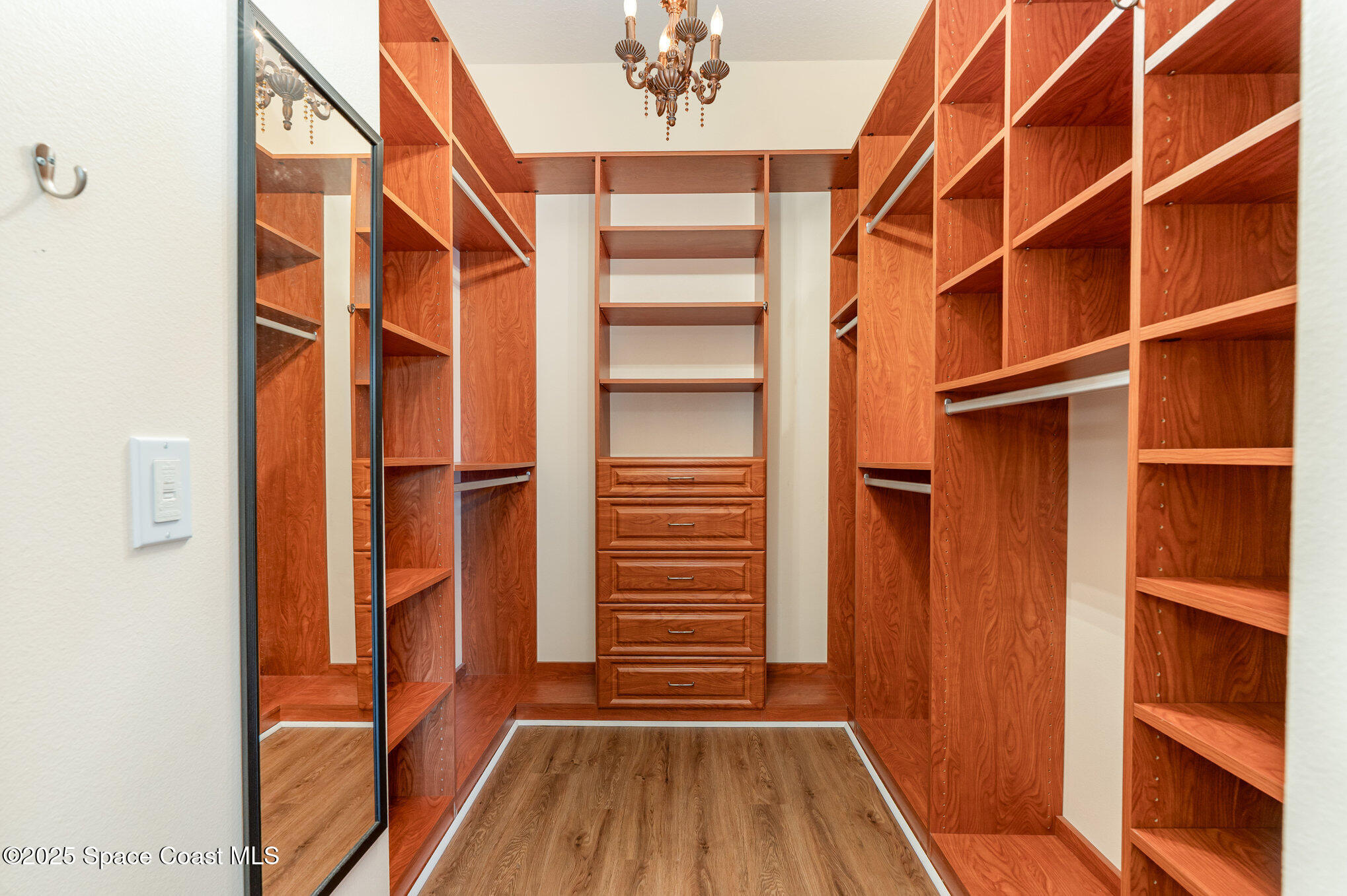 4150 Alamanda Key Drive Melbourne, FL 32901 - Photo 19 of 65 a view of walk in closet with empty racks