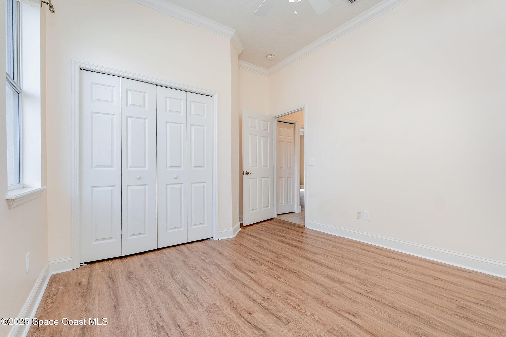 4150 Alamanda Key Drive Melbourne, FL 32901 - Photo 22 of 65 a view of an empty room with wooden floor