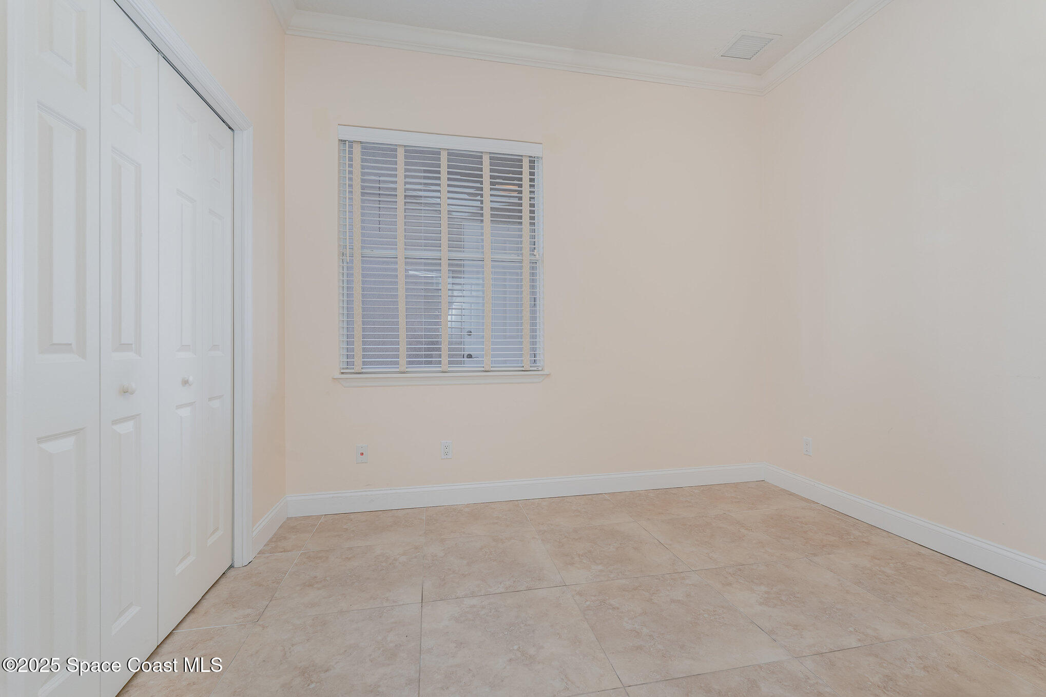 4150 Alamanda Key Drive Melbourne, FL 32901 - Photo 26 of 65 an empty room with windows
