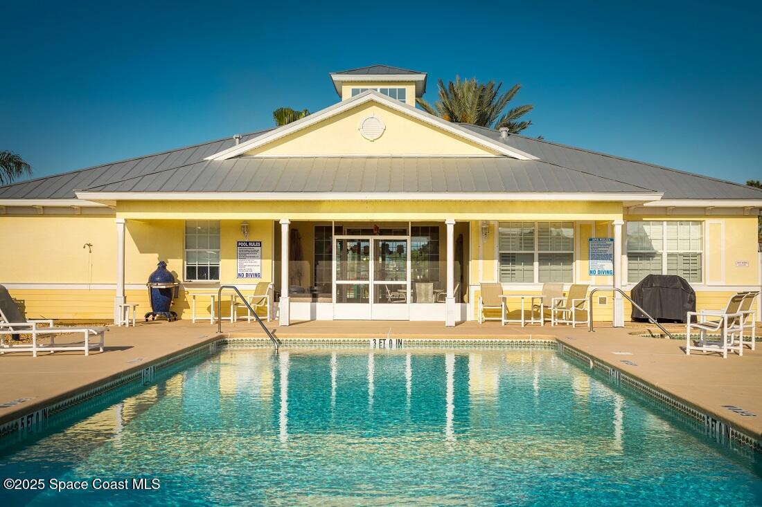 4150 Alamanda Key Drive Melbourne, FL 32901 - Photo 39 of 65 a front view of a house with a yard