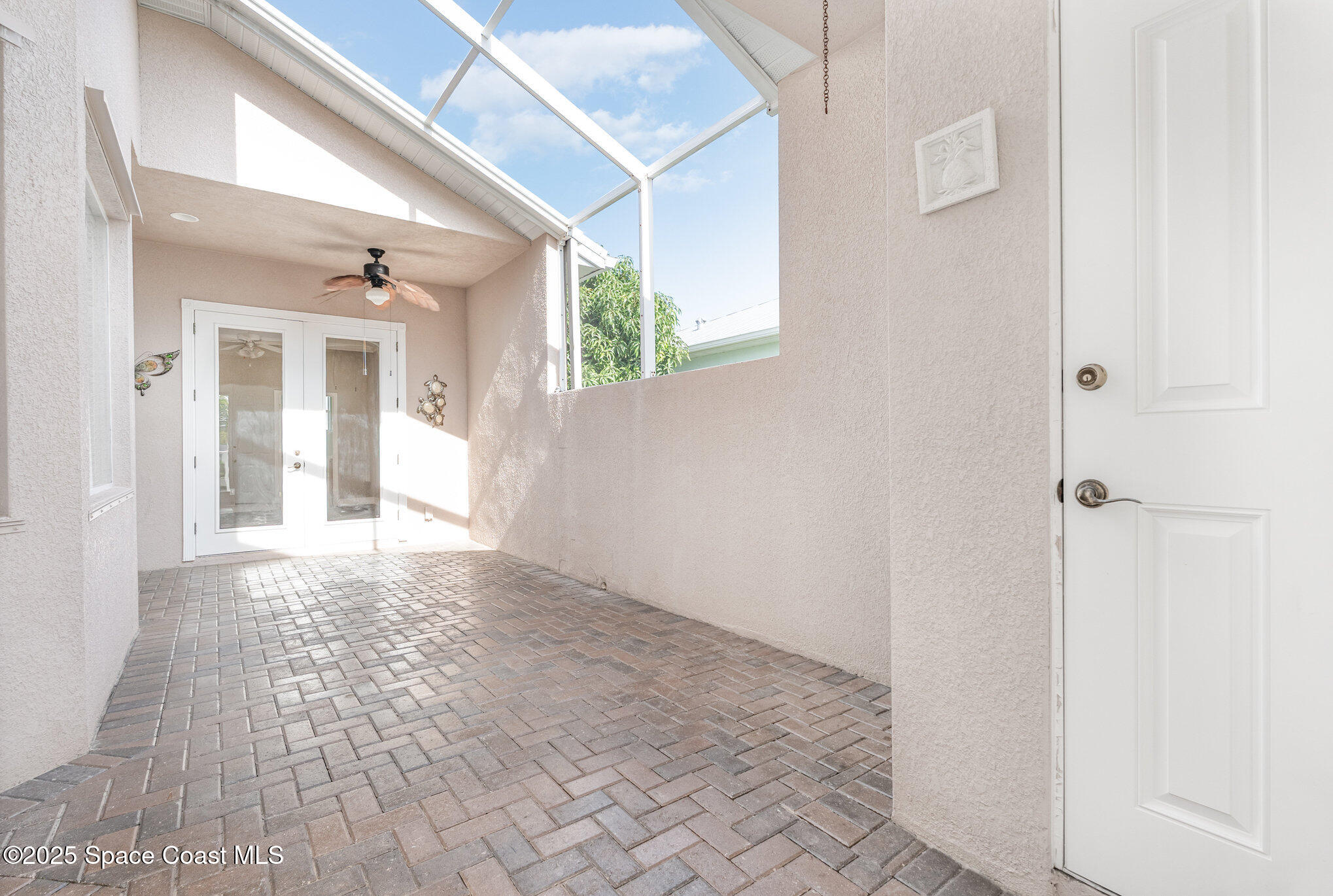 4150 Alamanda Key Drive Melbourne, FL 32901 - Photo 5 of 65 a view of a hallway with wooden floor and a bathroom