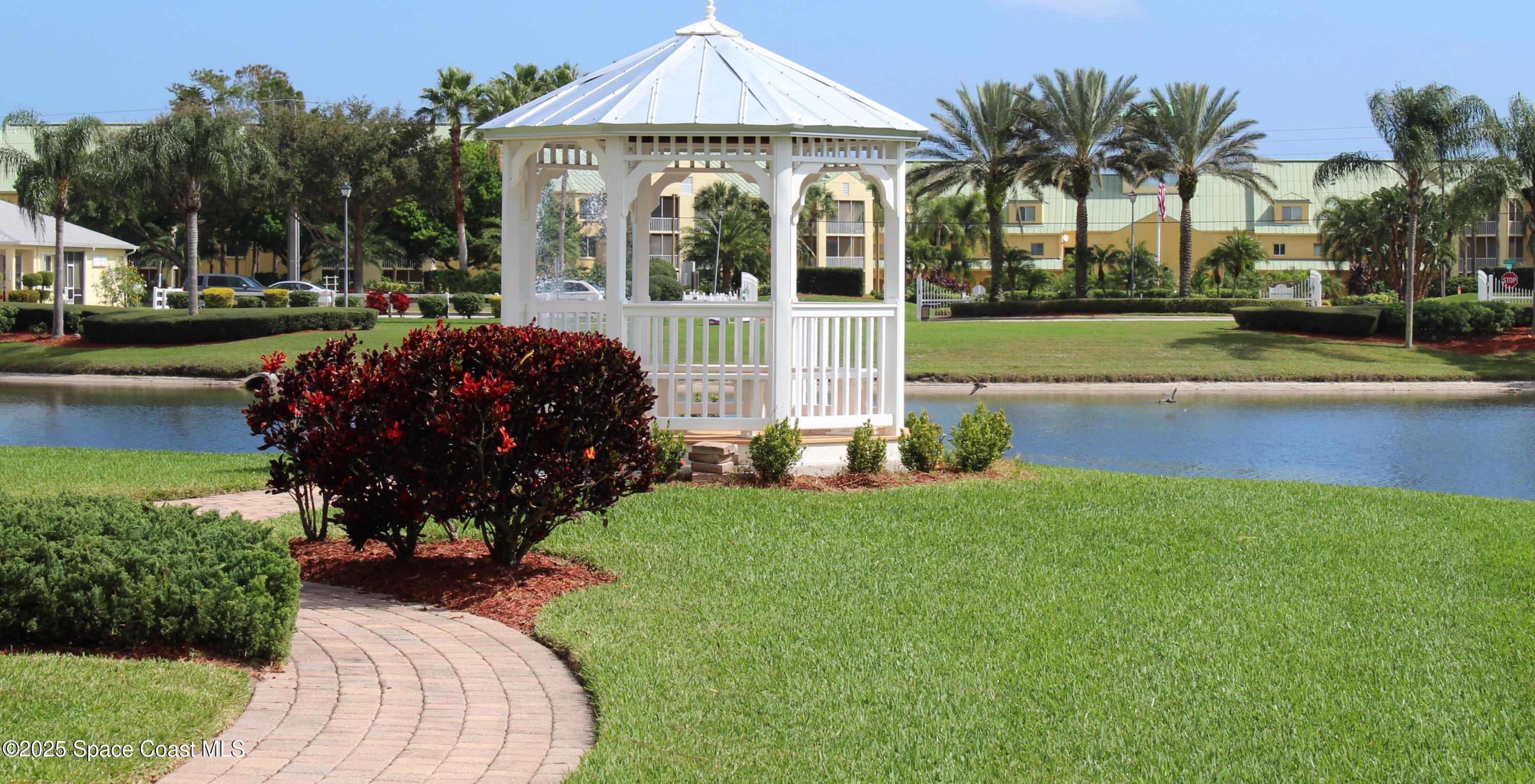 4150 Alamanda Key Drive Melbourne, FL 32901 - Photo 50 of 65 a front view of a house with garden