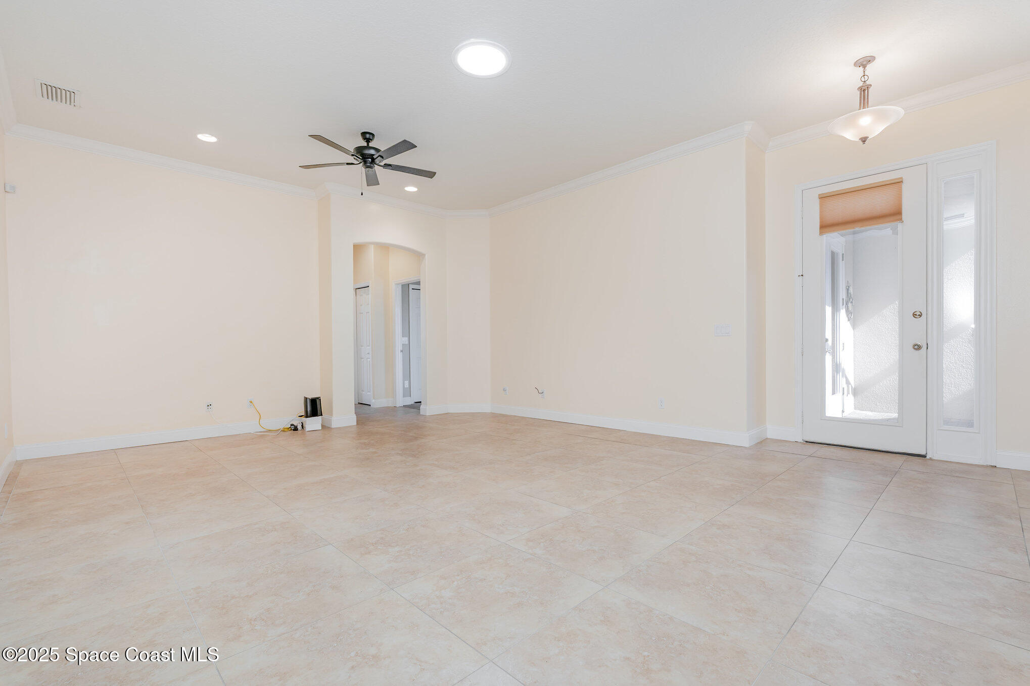 4150 Alamanda Key Drive Melbourne, FL 32901 - Photo 9 of 65 an empty room with fan and windows